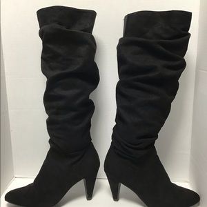 Black tall pair of boots size 6.5 in almost new condition.